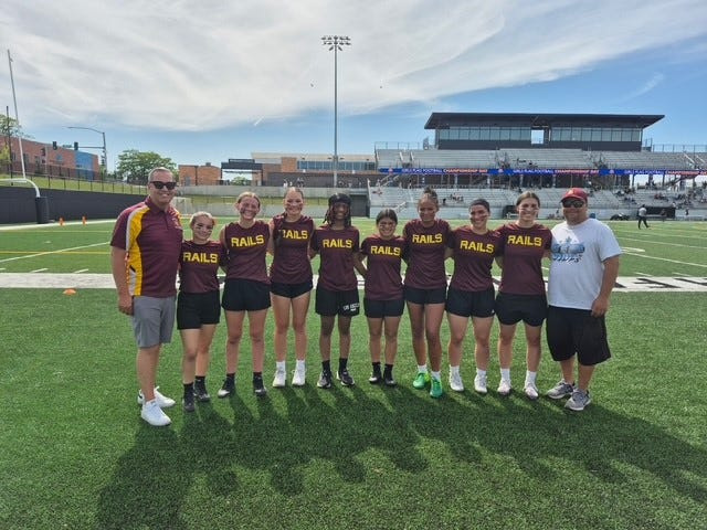Gary Dickey (left) and Cassidy Dickey (second from left) were a part of Des Moines Lincoln's success in girls flag football during the league's inaugural season.