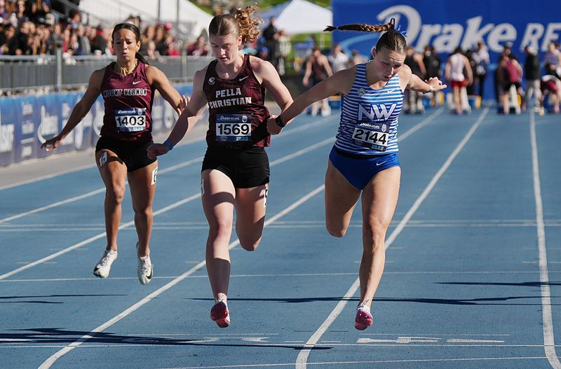 Waukee Northwest Katie Willits and Pella Christian Rachel Kacmarynski finishes 100-meter dash preliminary
in the Drake Relays at drake Stadium on April 24, 2026, in Des Moines, Iowa.