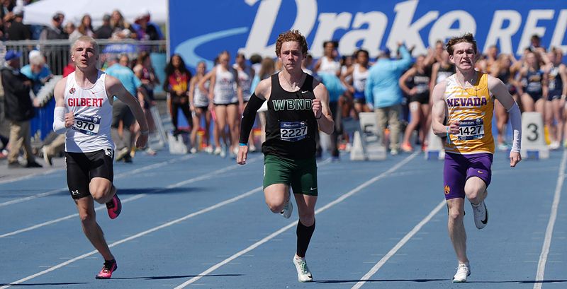 Gilbert’s Tanner Twedt (left), West Burlington’s Landry Haberichter and Nevada’s Connor Kunze (right) battle during the high school boys 100-meter dash finals during the Drake Relays on April 24 in Des Moines.