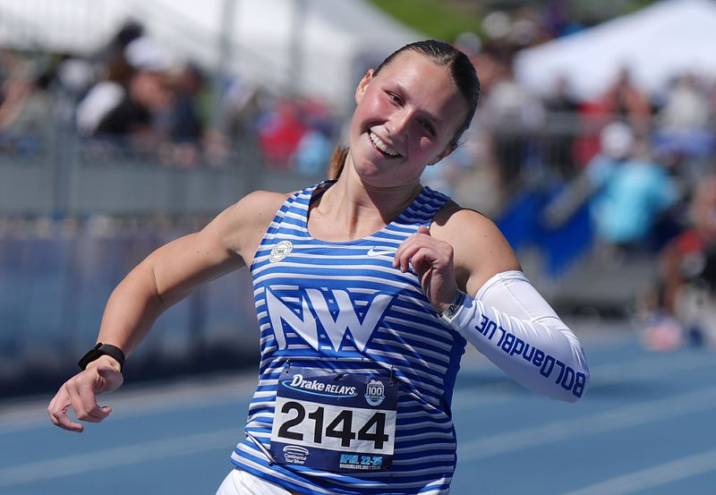 Waukee Northwest’s Katie Willits celebrates after winning high school girls 100-meter dash final in the Drake Relays at drake Stadium on April 24, 2026, in Des Moines, Iowa.