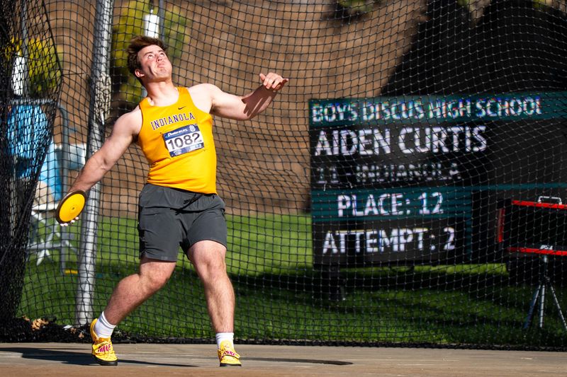 Indianola’s Aiden Curtis winds up to throw on April 25, 2026, at Drake Stadium in Des Moines.