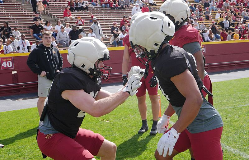 Iowa State running back Aiden Flora (21) warms up with the team mates during Spring football at Jack Trice Stadium on April 25, 2026, in Ames, Iowa
