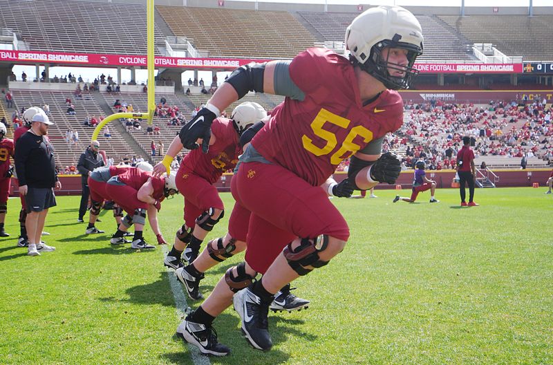 Iowa State offensive line Colin Amick (56) warms up with teammates before the spring football game at Jack Trice Stadium on April 25, 2026, in Ames, Iowa