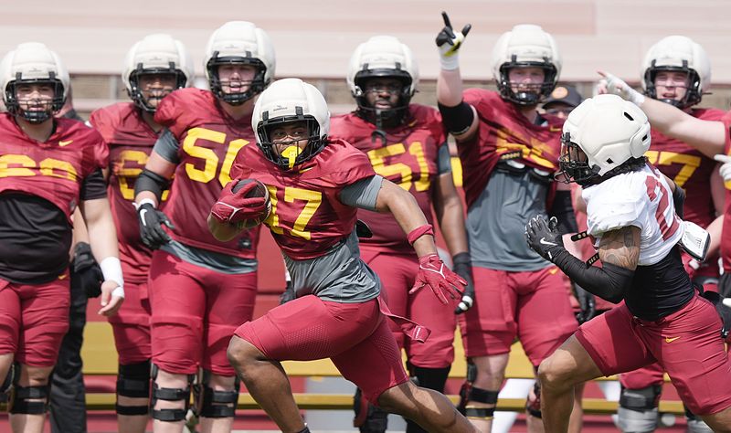 Iowa State running back Jayden Jackson (47) runs with the ball around defensive back Xavier Martinez (22) during Spring football at Jack Trice Stadium on April 25, 2026, in Ames, Iowa