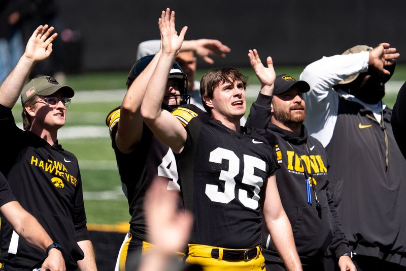 Iowa punter Tanner Philpott (35) waves to patients at the Stead Family Children’s Hospital April 25, 2026 during the team’s spring practice at Kinnick Stadium in Iowa City, Iowa.