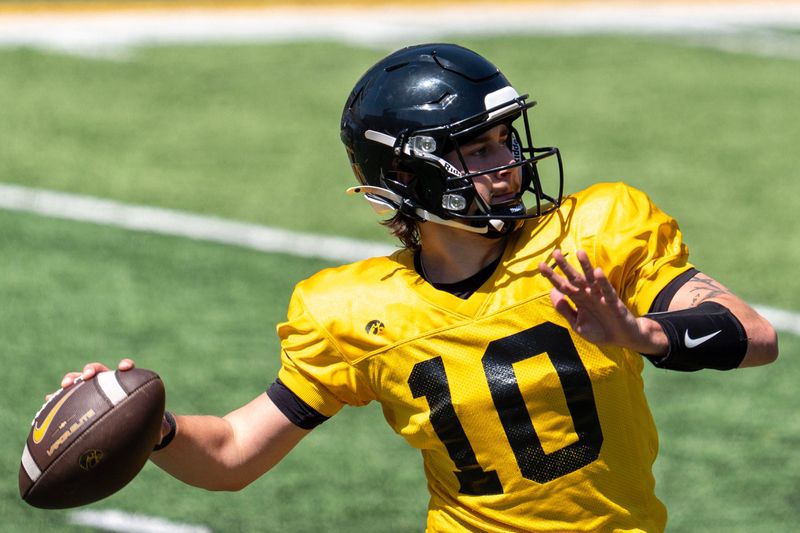 Iowa quarterback Jeremy Hecklinski (10) passes the football on April 25, 2026, during the team's spring practice at Kinnick Stadium in Iowa City, Iowa.