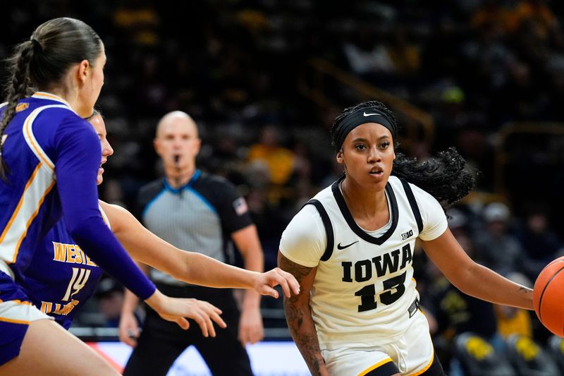 Iowa guard Kennise Johnson (13) drives toward the lane against the Western Illinois Leathernecks Nov. 26, 2025 at Carver-Hawkeye Arena in Iowa City, Iowa.