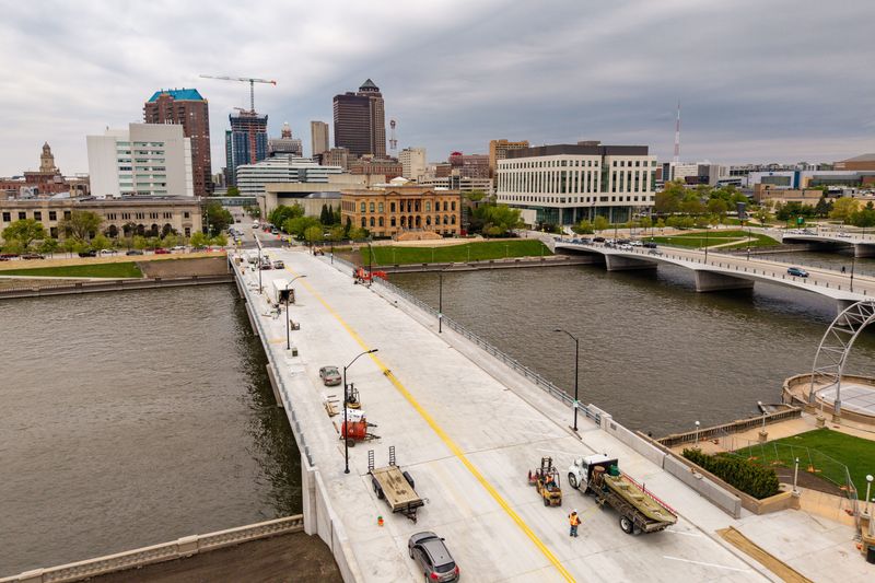 Workers put the finishing touches on the Walnut Street bridge, April 30, 2026 in Des Moines.