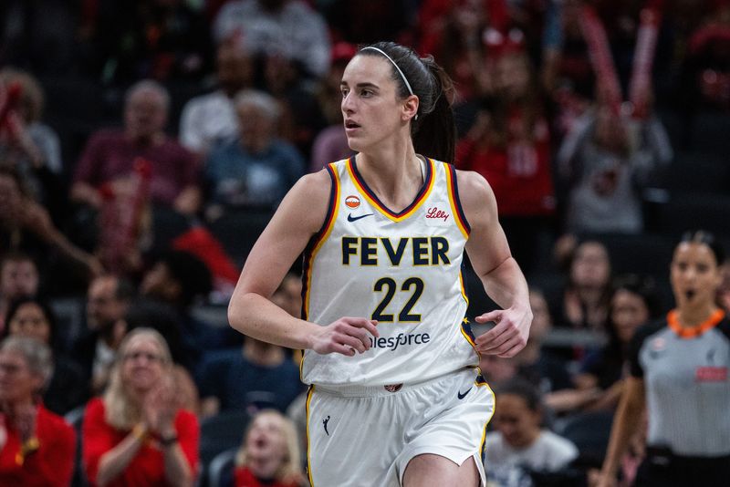 Apr 30, 2026; Indianapolis, IN, USA; Indiana Fever guard Caitlin Clark (22) celebrates a made shot in the first half against the Dallas Wings at the Gainbridge Fieldhouse. Mandatory Credit: Trevor Ruszkowski-Imagn Images