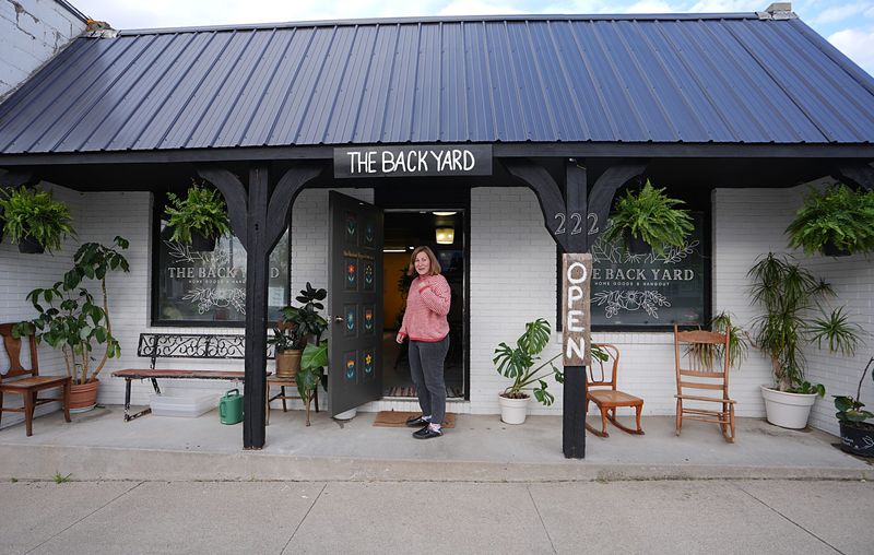 Local artist Local artist/owner Shelby Smith poses at her art gallery/coffee shop/cocktail bar in the The Back Yard on April 30, 2026, in Collins, Iowa.
