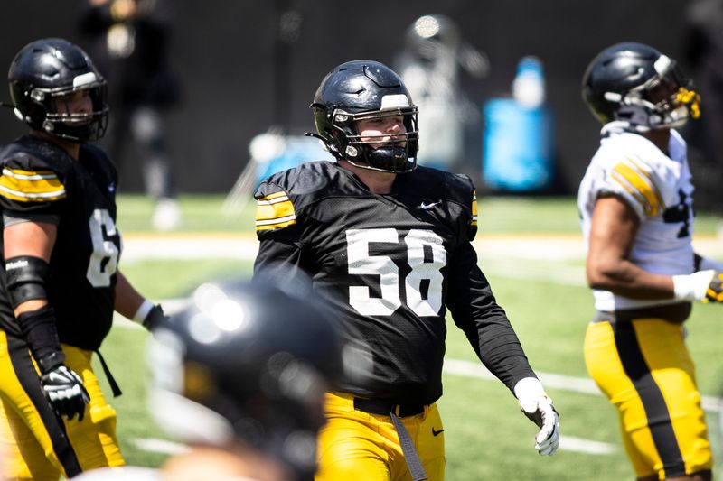 Apr 26, 2025; Iowa City, IA, USA; Iowa offensive lineman Kade Pieper looks to the sideline during a spring NCAA football open practice at Kinnick Stadium. Mandatory Credit: Joseph Cress/For the Register