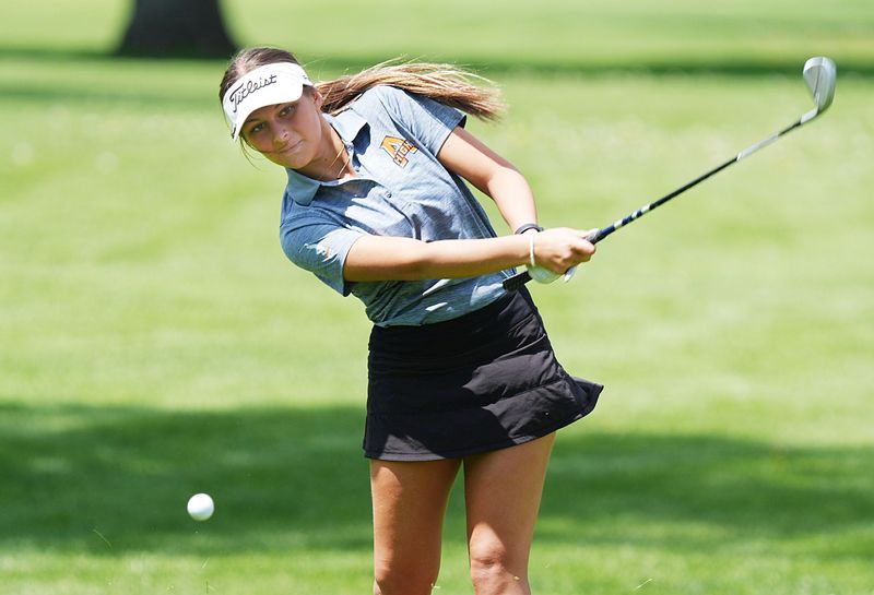 Ames senior Avery Voss looks at the ball after a chip shot on the 10th hole during the Turk Bowman Invitational at the Veenker Memorial Golf Course on May 4 in Ames. Voss was golfing for her father and Ames head coach RJ Voss, who will miss the rest of the season as he recovers from open-heart surgery.