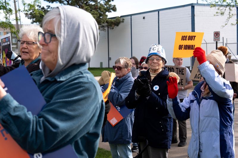 Protesters gathered during a rally hosted by Escucha Mi Voz to support immigrant families during their ICE check-ins May 5, 2026 in Cedar Rapids, Iowa.