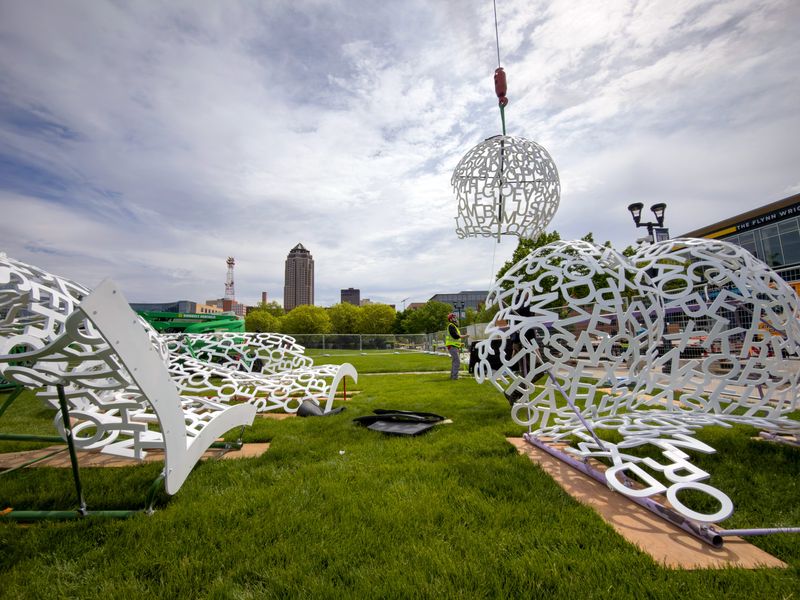 Jaume Plensa’s sculpture Nomade (2007), is reinstalled in the John and Mary Pappajohn Sculpture Park by workers from the Des Moines Art Center, May 5, 2026.