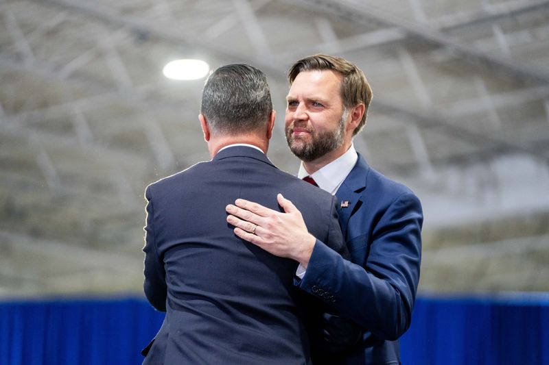 Vice President JD Vance embraces U.S. Rep. Zach Nunn as he takes the stage on May 5, 2026, at Ex-Guard in Des Moines.