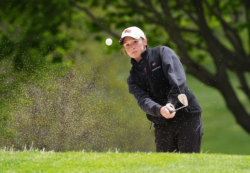 Roland-Story’s Hadley Carlson looks at the ball during the HOIC tournament at the Lincoln Valley Golf Course on May 6 in State Center. Carlson is chasing her big sister Brinley atop the individual standings for Roland-Story and she could be the key to the Norse winning their second Class 2A state team championship in four years.