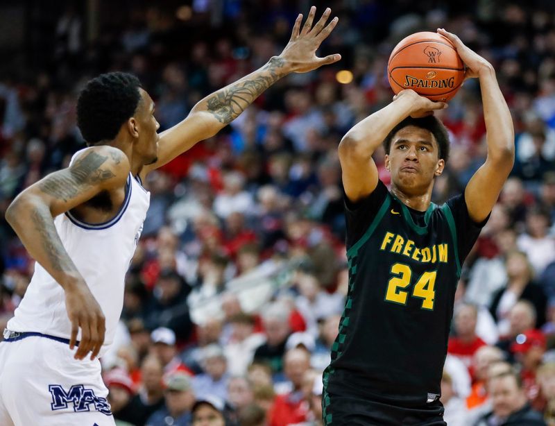 Freedom High School's Donovan Davis (24) shoots the ball against Milwaukee Academy of Science during the WIAA Division 3 state championship game on Saturday, March 22, 2025, at the Kohl Center in Madison, Wis. Milwaukee Academy of Science won the game, 57-54.
Tork Mason/USA TODAY NETWORK-Wisconsin