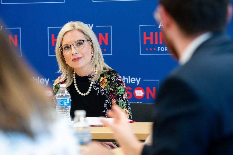 U.S. Rep. and Senate candidate Ashley Hinson listens as Colin Gorton speaks during a roundtable on May 8, 2026, in Ankeny.