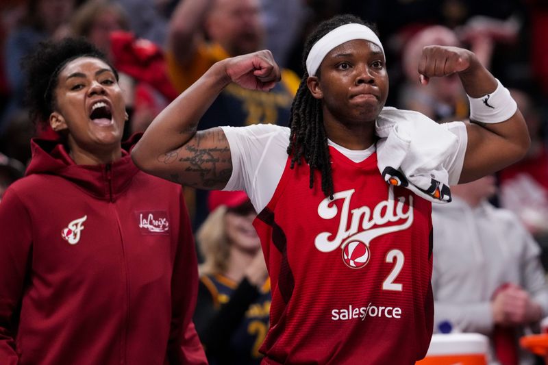 Indiana Fever center-forward Damiris Dantas (12) and Indiana Fever forward Myisha Hines-Allen (2) celebrate from the bench Saturday, May 9, 2026, during the second half of the Fever’s season opener game at Gainbridge Fieldhouse in Indianapolis. The Dallas Wings defeated the Indiana Fever, 107-104.