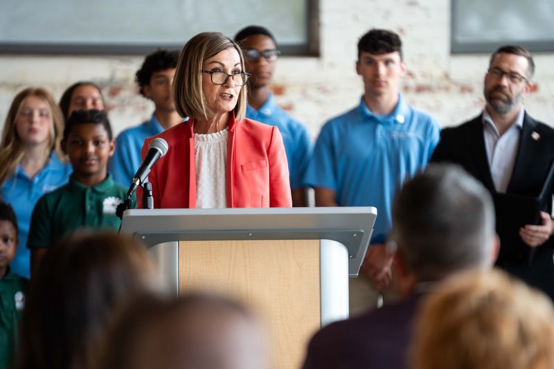 Gov. Kim Reynolds speaks during a bill signing for HF 2754, a charter school funding bill, on May 12, 2026, at Des Moines Prep.