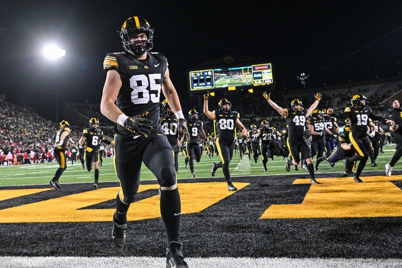 Nov 29, 2024; Iowa City, Iowa, USA; Iowa Hawkeyes tight end Luke Lachey (85) and teammates react after the game against the Nebraska Cornhuskers at Kinnick Stadium. Mandatory Credit: Jeffrey Becker-Imagn Images