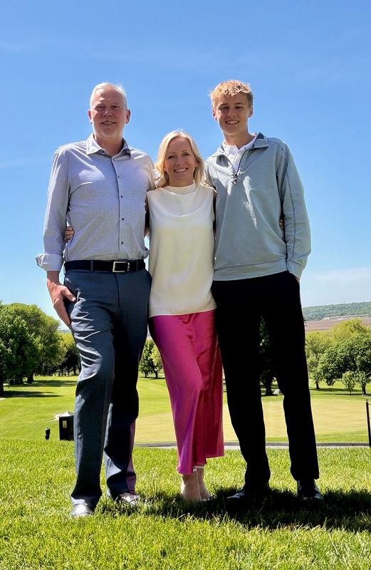 Marek Dessimoz, right, along with his parents, Douglas Kaye and Agnieszka Pieta, pose for a photo on Mother's Day, May 10, 2026.