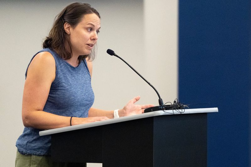 Katie Linder speaks May 12, 2026 during the community comment section of an Iowa City Community School District board meeting in Iowa City, Iowa.