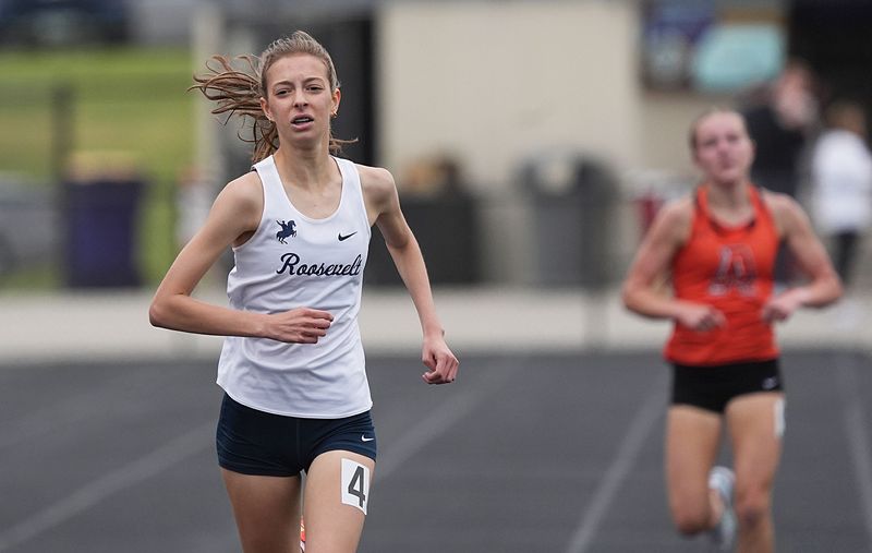 Des Moines Roosevelt’s Isabel Spradling finishes first in the girls 3,000-meter run during the Class 4A state qualifying co-ed track and field meet at Indianola High School on May 14 in Indianola, Iowa.