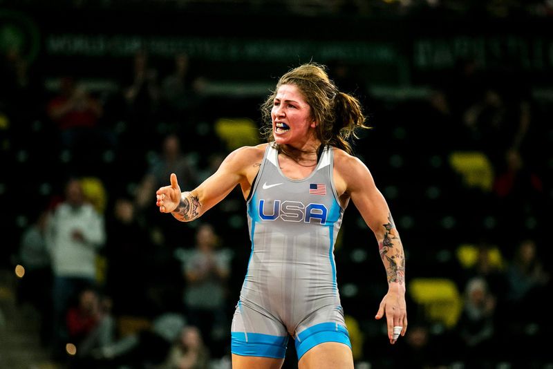 Jenna Burkert of the United States celebrates after scoring a decision at 55 kg during the United World Wrestling women's freestyle World Cup, Saturday, Dec. 10, 2022, at Xtream Arena in Coralville, Iowa.