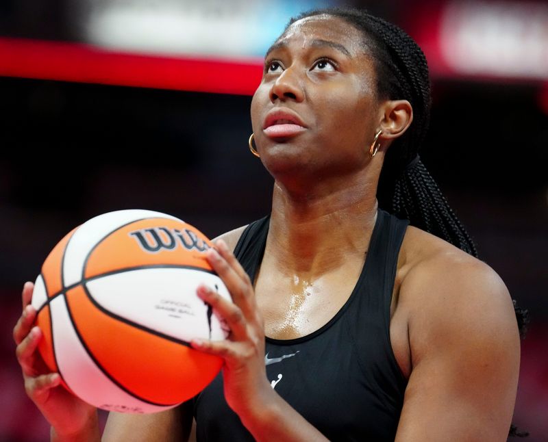 Indiana Fever forward Aliyah Boston (7) warms up before a game against the Las Vegas Aces on Sunday, Sept. 28, 2025, at Gainbridge Fieldhouse in Indianapolis.