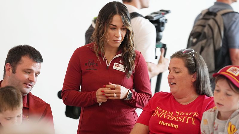 Iowa State women’s wrestling coach Alli St. John talks to fans during Cyclone Tailgate Tour at Curate on may 18, 2026, in Des Moines, Iowa.