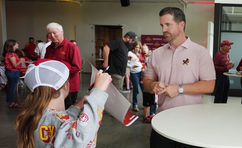 Iowa State football head coach Jimmy Rogers sign a autograph during Cyclone Tailgate Tour at Curate on may 18, 2026, in Des Moines, Iowa.