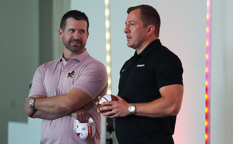 Iowa State football coach Jimmy Rogers and men’s basketball head coach T.J. Otzelberger talks to each other during Cyclone Tailgate Tour at Curate on may 18, 2026, in Des Moines, Iowa.