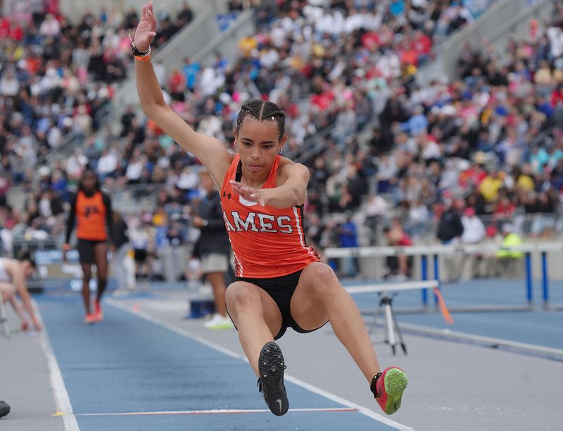 Ames’ Sophia Hatcher lands during 4A girls long jump in the Day-two of the Iowa state high school co-ed track and field at Drake Stadium on May 22, 2026, in Des Moines, Iowa.
