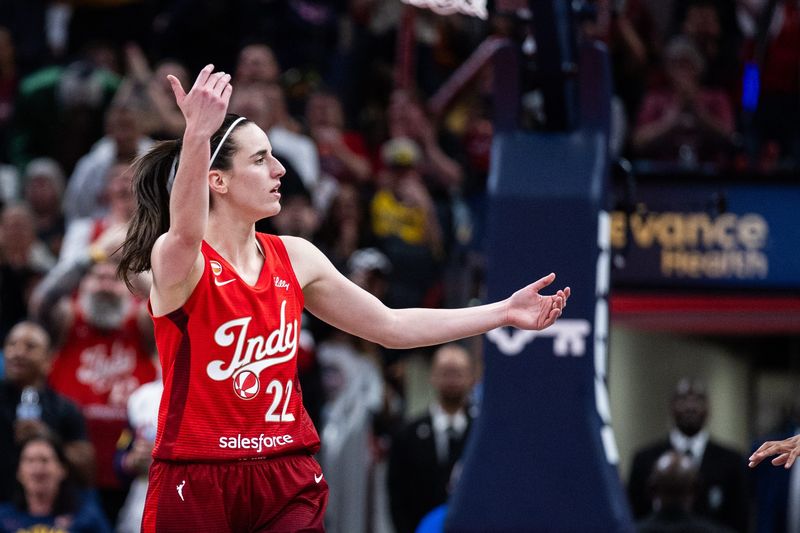 May 22, 2026; Indianapolis, Indiana, USA; Indiana Fever guard Caitlin Clark (22) celebrates a made shot in the second half against the Golden State Valkyries at Gainbridge Fieldhouse. Mandatory Credit: Trevor Ruszkowski-Imagn Images