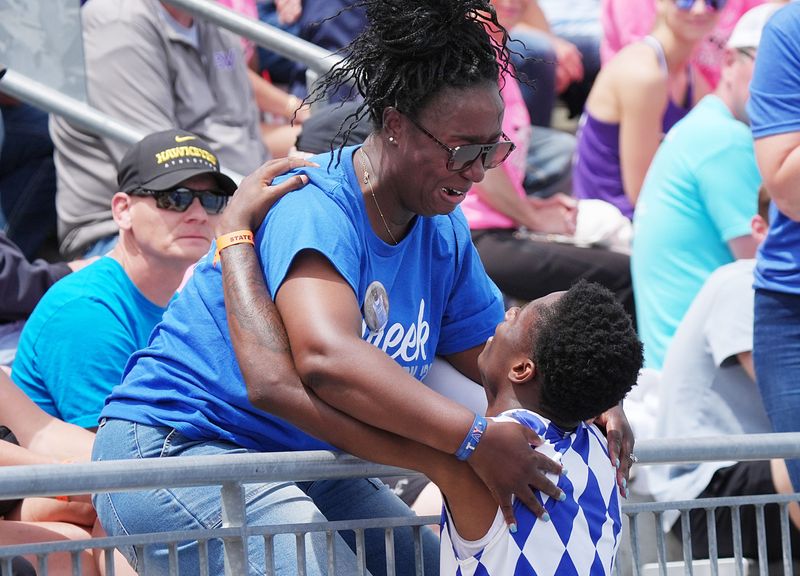 Clear Creek-Amana’ Tay Seals celebrates with his mother Jamie Bowman after winning the 3A boys 110-meter hurdles final in the final day of the Iowa state high school co-ed track and field at Drake Stadium on May 23, 2026, in Des Moines, Iowa.