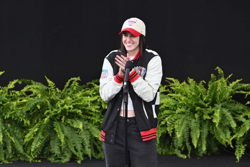 May 24, 2026; Indianapolis, Indiana, USA; Indiana Fever guard Caitlin Clark announces before the 110th Running of the Indianapolis 500 at Indianapolis Motor Speedway. Mandatory Credit: Marc Lebryk-Imagn Images