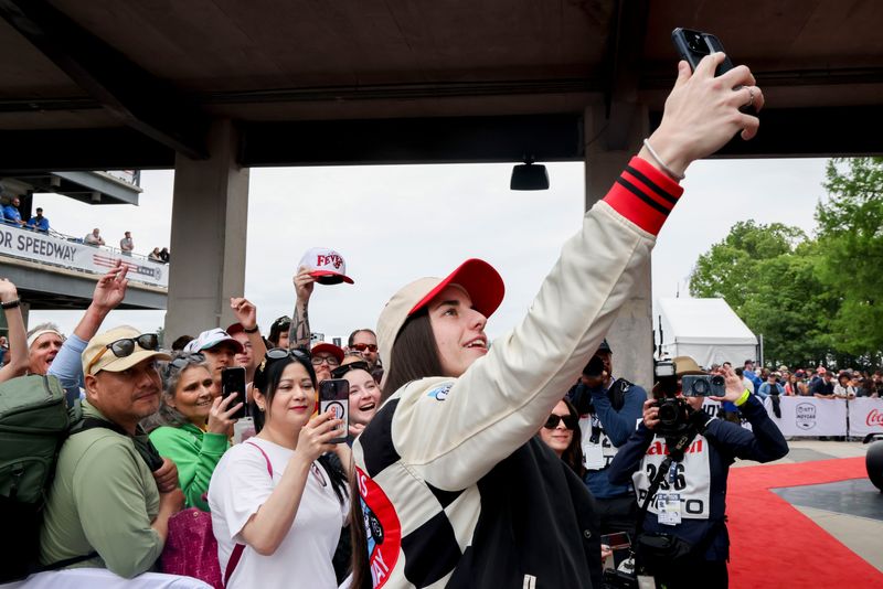 May 24, 2026; Indianapolis, Indiana, USA; Indiana Fever guard Caitlin Clark walks the red carpet on Sunday, May 24, 2026, ahead of the 110th running of the Indianapolis 500 at Indianapolis Motor Speedway. Mandatory Credit: Edwin Locke-USA TODAY Network via Imagn Images