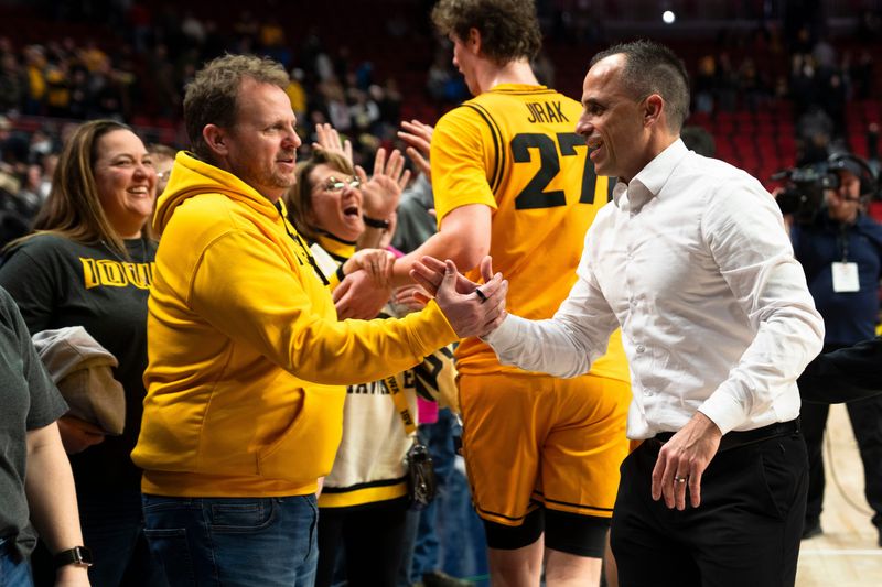 Iowa head coach Ben McCollum greets fans after a game at Casey's Center on Saturday, Dec. 20, 2025 in Des Moines.