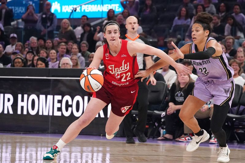 May 28, 2026; San Francisco, California, USA; Indiana Fever guard Caitlin Clark (22) dribbles against Golden State Valkyries guard Veronica Burton (22) in the first quarter at Chase Center. Mandatory Credit: David Gonzales-Imagn Images
