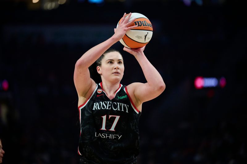May 14, 2026; Portland, Oregon, USA; Portland Fire center Megan Gustafson (17) shoots a free throw during the first half against New York Liberty at Moda Center. Mandatory Credit: Troy Wayrynen-Imagn Images