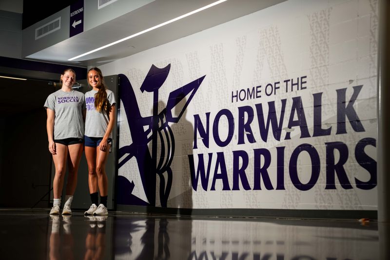 Norwalk’s Katie Liedtke and Pearl Brown stand for a photo on May 28, 2026, at Norwalk High School.