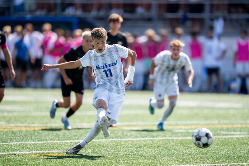 Waukee Northwest's Eman Alicic (11) shoots a penalty kick to put Northwest into the lead over Ankeny Centennial in the 4A state soccer championship on June 5, 2026, at Mediacom Stadium in Des Moines.