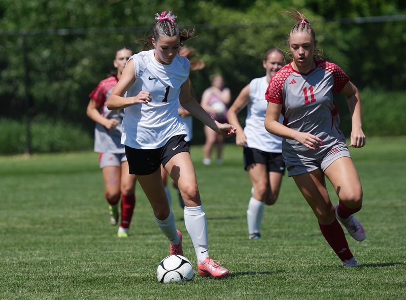 Gilbert midfielder Allie Grandgenett (1) dribbles the ball down field against North Scott during the Tigers' 3-0 loss in the state soccer quarterfinals on June 8 in Ames.