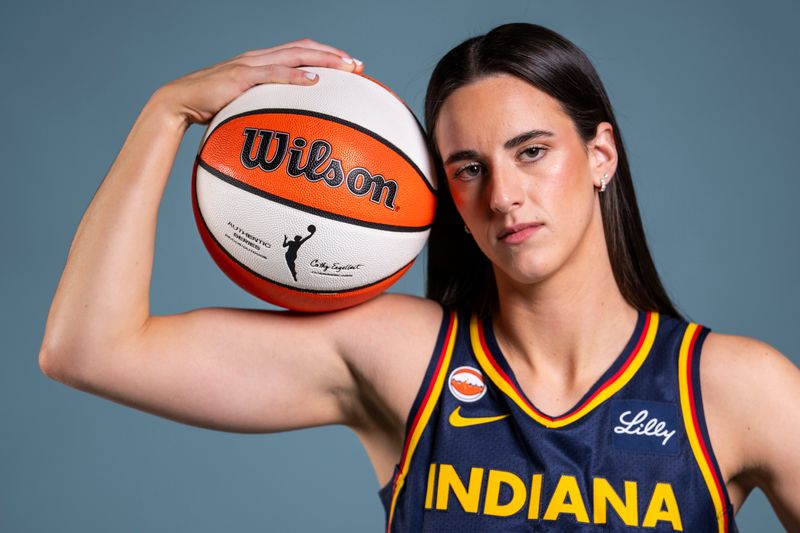 Indiana Fever guard Caitlin Clark (22) poses for a photo Wednesday, April 22, 2026, during media day at Gainbridge Fieldhouse in Indianapolis.