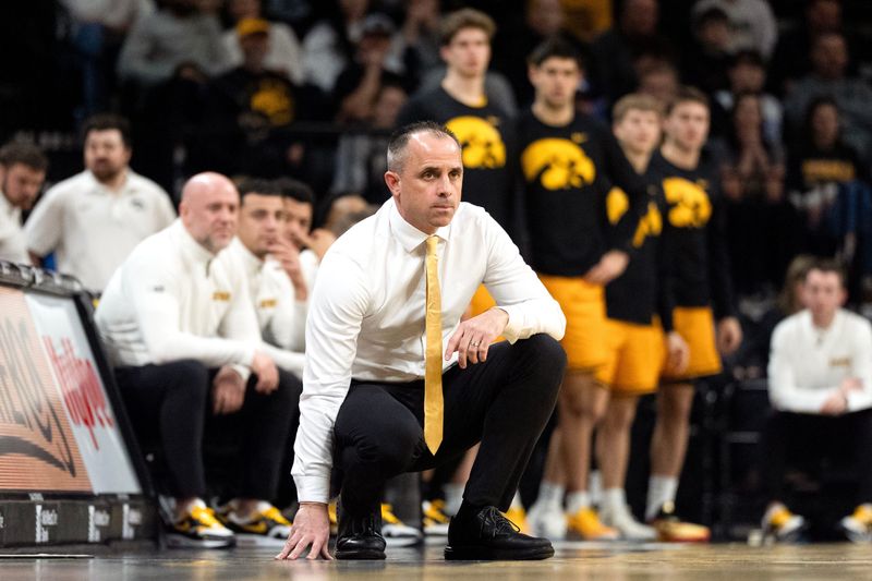 Iowa head coach Ben McCollum watches his team compete against the Ohio State Buckeyes Feb. 25, 2026 at Carver-Hawkeye Arena in Iowa City, Iowa.