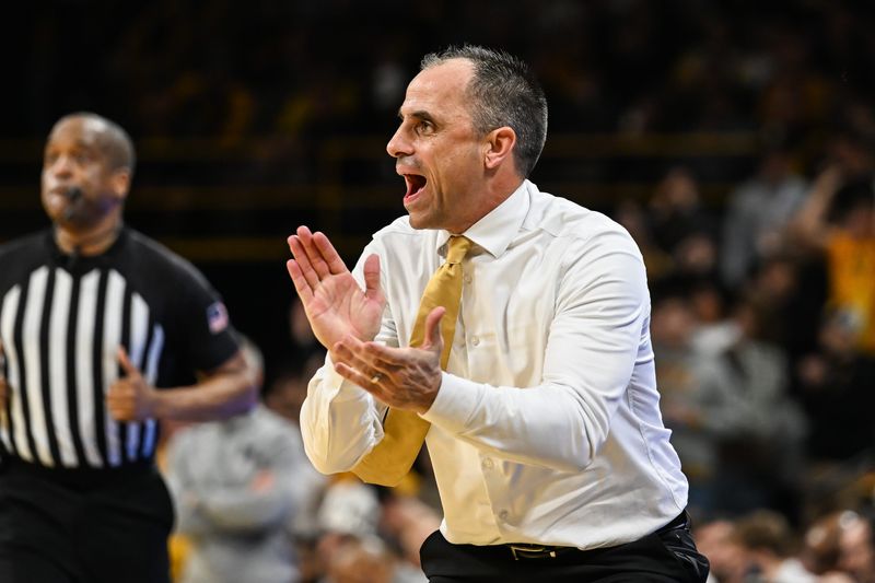 Mar 5, 2026; Iowa City, Iowa, USA; Iowa Hawkeyes head coach Ben McCollum reacts during the first half against the Michigan Wolverines at Carver-Hawkeye Arena. Mandatory Credit: Jeffrey Becker-Imagn Images