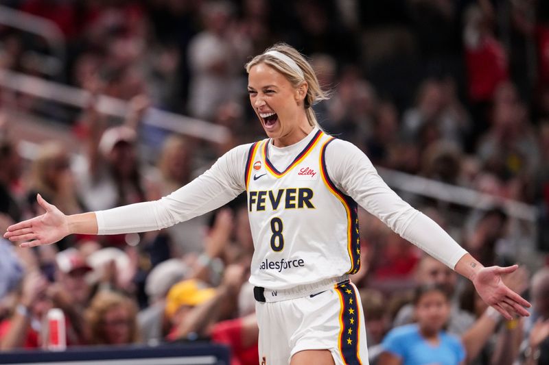 Indiana Fever guard Sophie Cunningham (8) celebrates a 3-pointer Tuesday, June 16, 2026, during the first half of a game at Gainbridge Fieldhouse in Indianapolis.