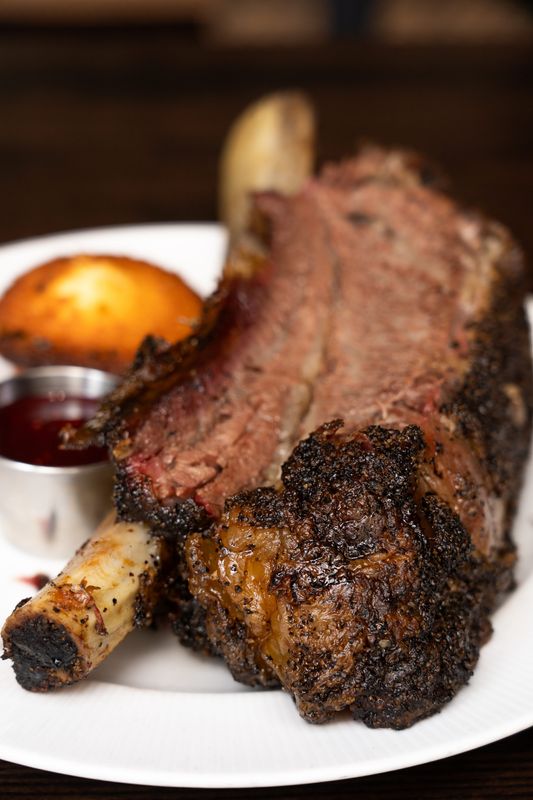 Bubba Southern Comforts in downtown Des Moines celebrates 10 years with four events starting June 24 with a pop-up lunch and dinner with Whatcha Smokin' from Luther, Iowa. The dino bone features a one-pound smoked beef rib, chimichurri, coleslaw, baked beans, cornbread muffin and house jam.