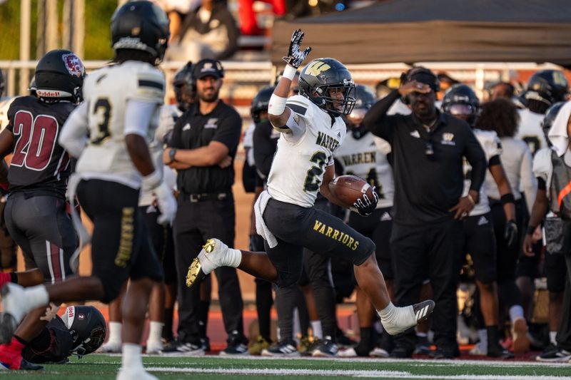 Warren Central High School senior Keyon Thomas (26) eludes Lawrence Central High School defenders during the first half of an IHSAA varsity football game, Friday, Sept. 12, 2025, at Lawrence Central High School.